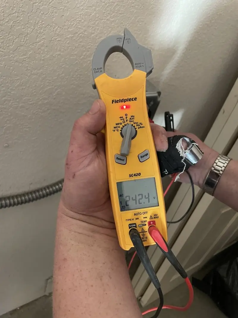 Voltage testing with clamp meter during Whole House Surge Protector in Albany